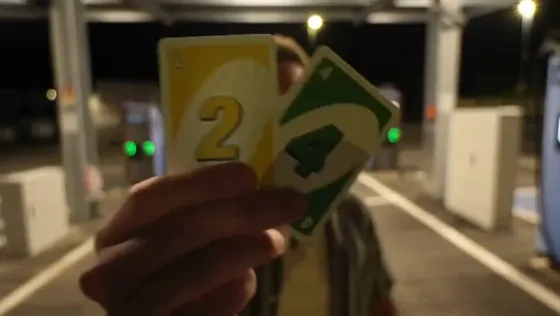 The 2 and 4 cards move close to the lens.